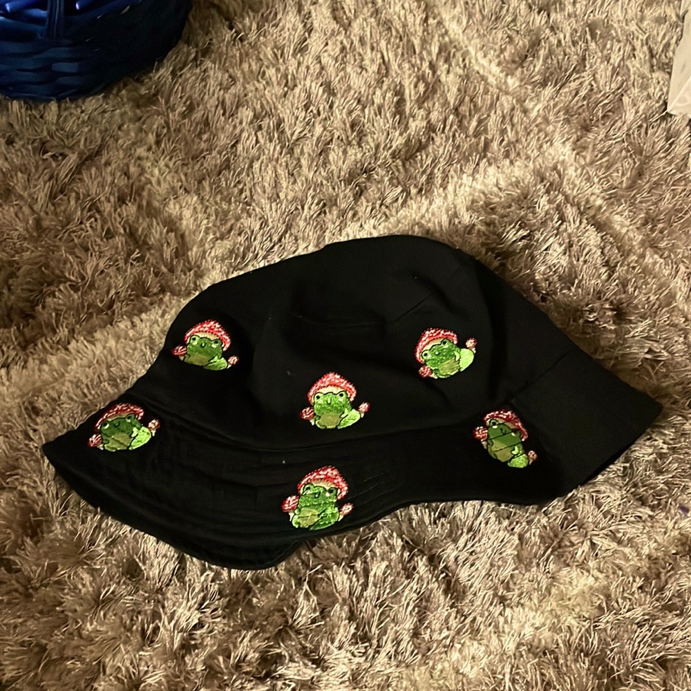 Bucket hat with frogs that are wearing mushroom hats